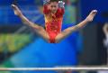 图文-中国女子体操队赛台训练 进行高低杠训练