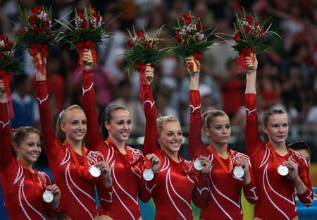 Chinese women gymnasts claim first Olympic team crown 