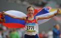  Photo and text - Beautiful smile in the rain in the women's 20km track and field walking final