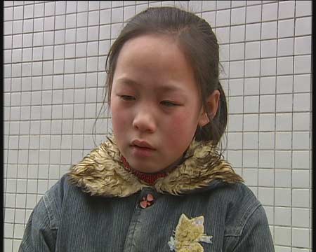 组图:父母到海口打工8年未见 留守儿童令人心