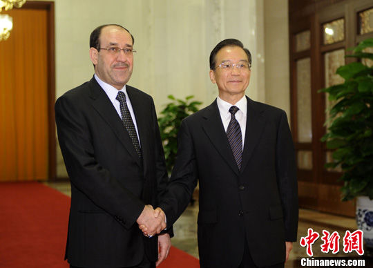 7月18日，中国国务院总理温家宝在北京人民大会堂举行仪式欢迎伊拉克总理马利基访华。中新社发 廖攀 摄