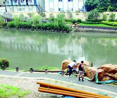 金川河入江口的排泥浆管道被拆了