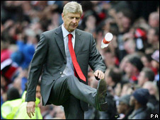 Arsenal manager Arsene Wenger taking out his frustration on a bottle