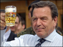 Former Chancellor of Germany enjoying a drink of beer