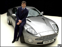 Pierce Brosnan as James Bond with an Aston Martin car