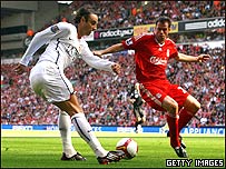 Manchester United player Dimitar Berbatov and Liverpool player Jamie Carragher