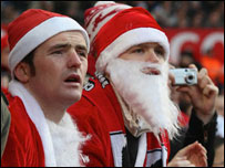 Fans dressed as Santa