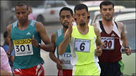 Runners, including Nader el Masri (in yellow) participate in the first Gaza marathon