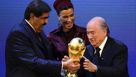 FIFA president Sepp Blatter hands over the World Cup trophy to the emir of Qatar Sheikh Hamad bin Khalifa al-Thani and his wife Chair in Zurich. Picture: AFP Source: AFP 