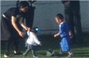  Sun Li and Xiao Hua watch and play football