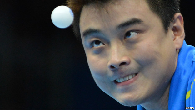 Wang Hao of China watches the ball during a table tennis match.
