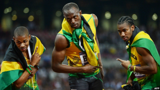 Usain Bolt celebrates with Jamaica's Yohan Blake and Warren Weir after the men's 200m final.