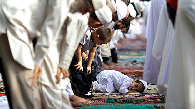 A Muslim boy is seen during the prayer session to celebrate Eid al-Fitr in Panama City.