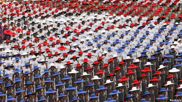 People wearing red, white and blue hats.