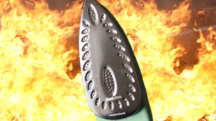 An iron with fire in the background