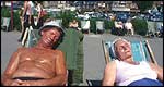 Two people sunbathing at the beach