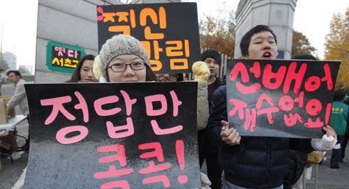 Outside the examination room mentees cheered for examination candidates.