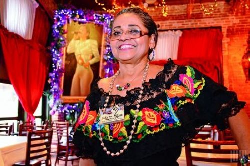 The Mi Tierra restaurant waiter like from the picture came out to patrons like smile