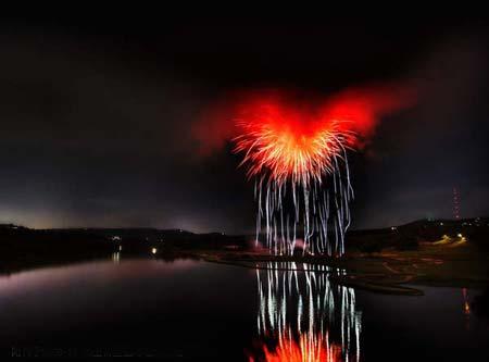 Heart of Satan - What it looks like when fireworks explode inside of a storm cloud over a river ڴ˹