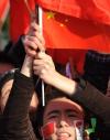 图文-北京奥运圣火在堪培拉传递 两颊都是红色