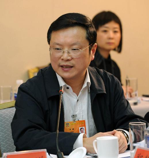 图文全国政协委员屈谦发言